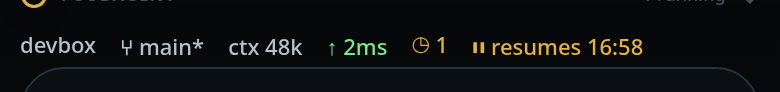 The status bar above the composer: the node name, the branch, the context figure, the latency, a queued count and an amber paused segment.